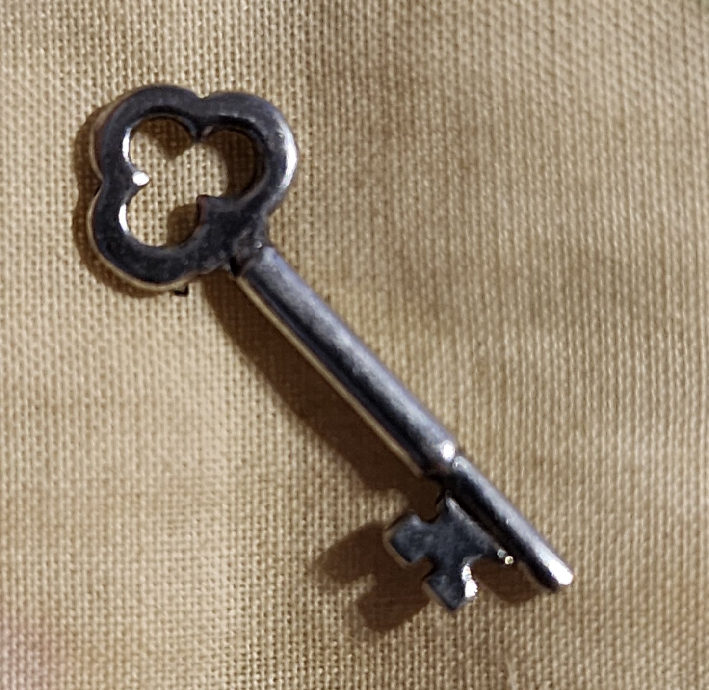 Metal key charm