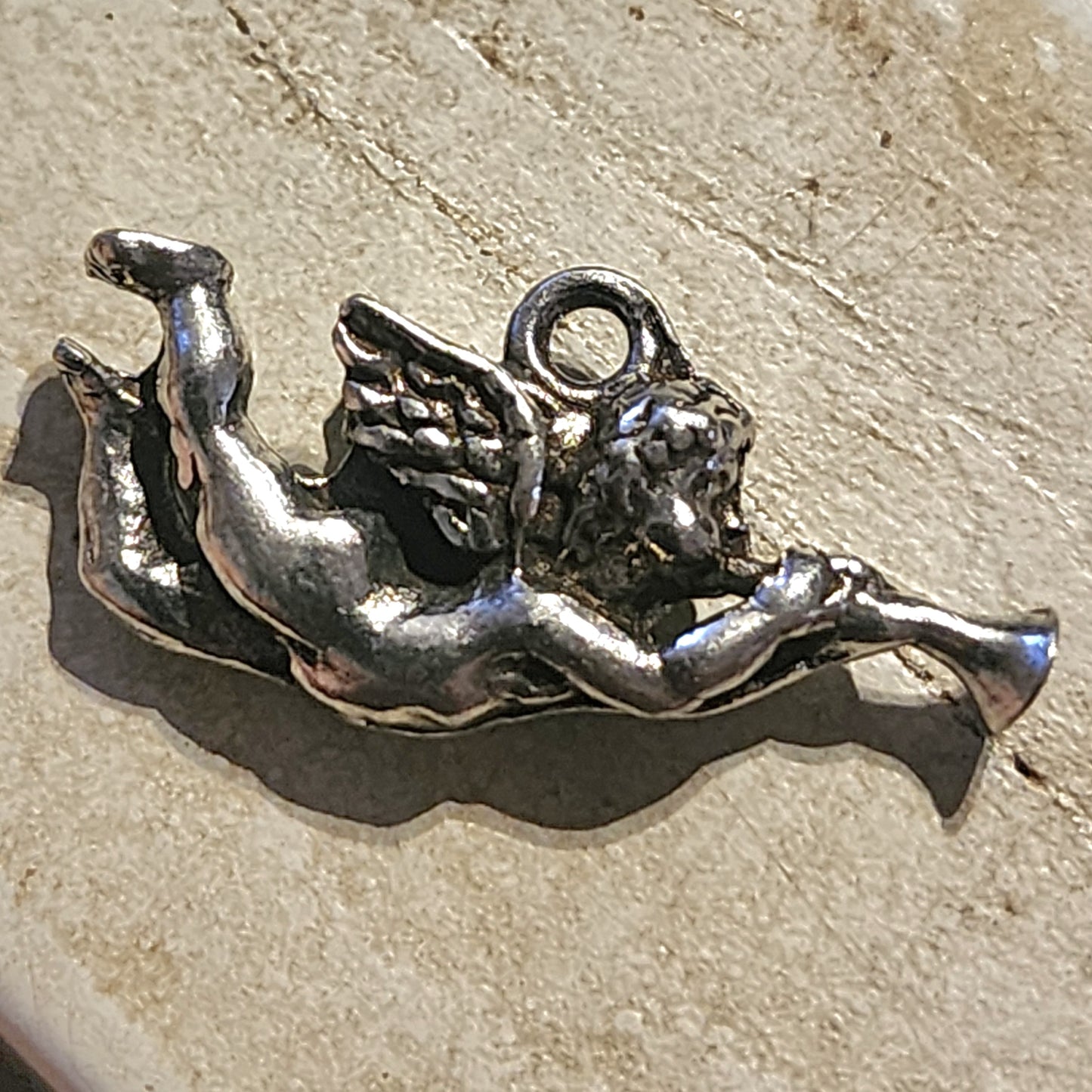 Metal cherub (angel) charm