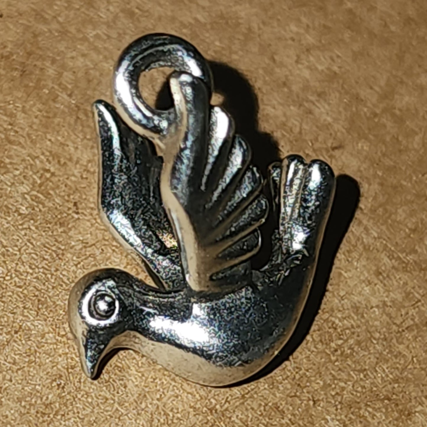 Metal dove charm