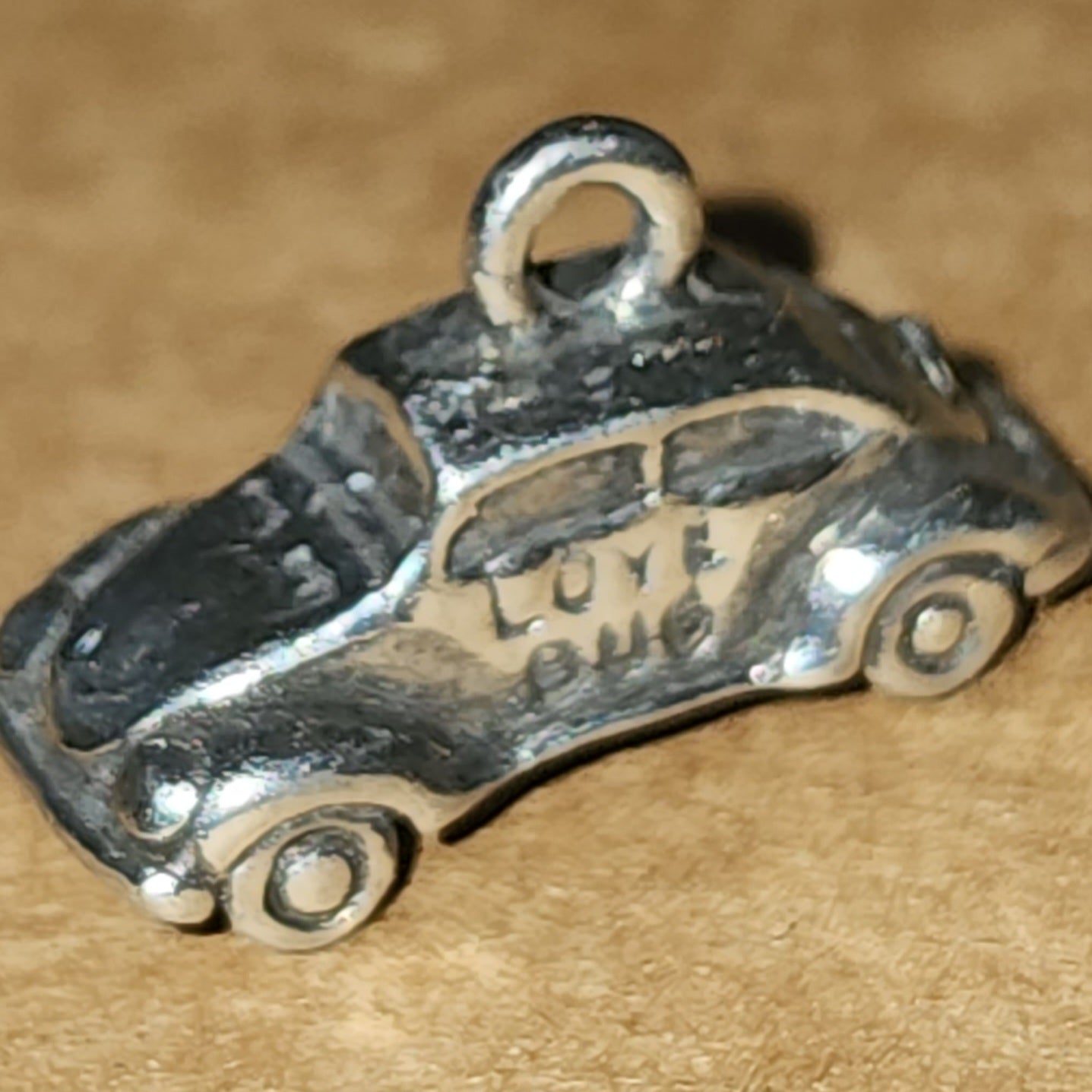 Metal love bug charm