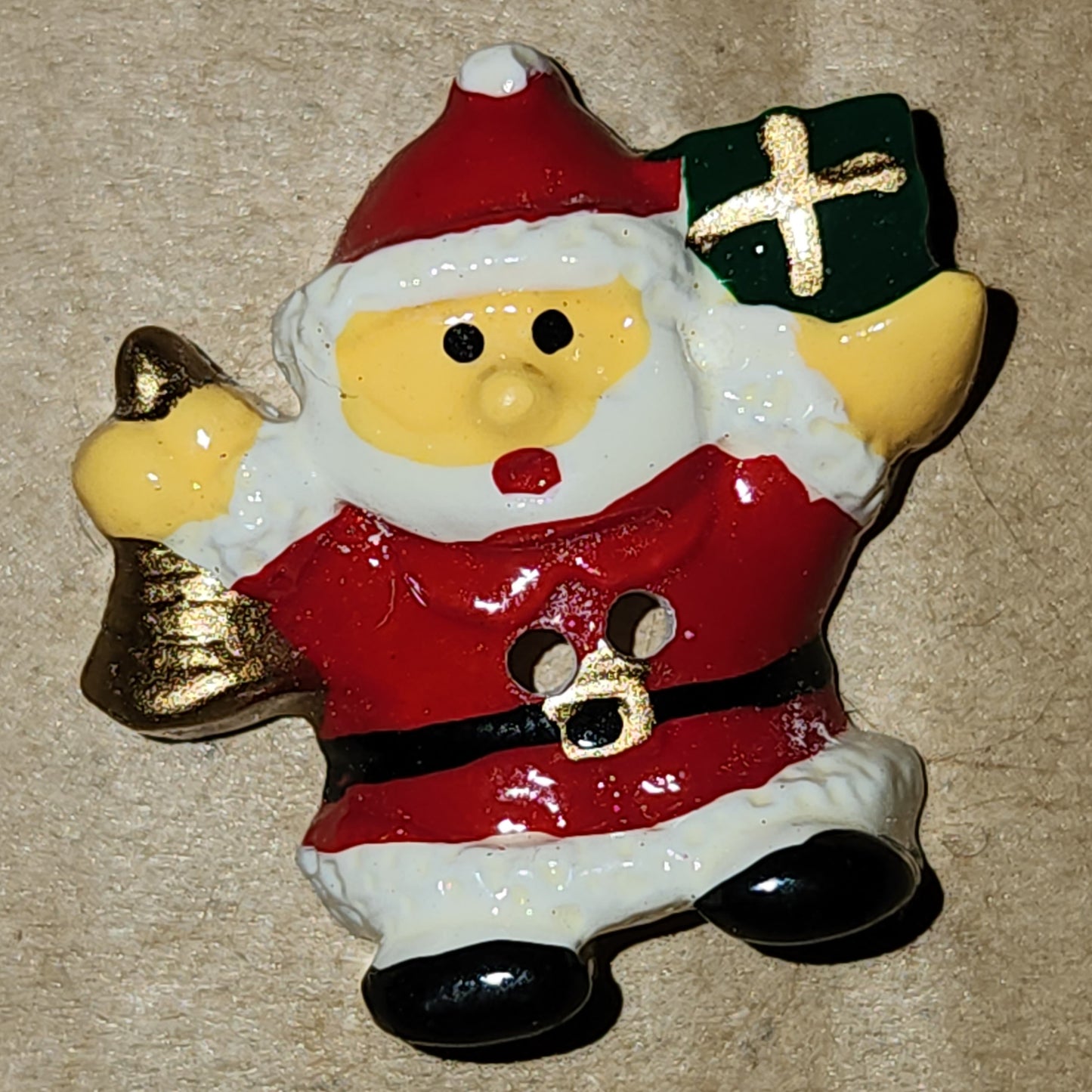 Santa with present button 22mm high