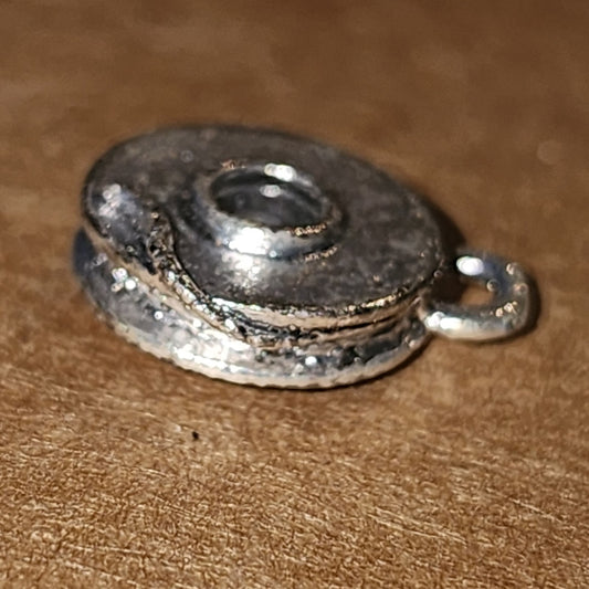 Metal bobbin charm