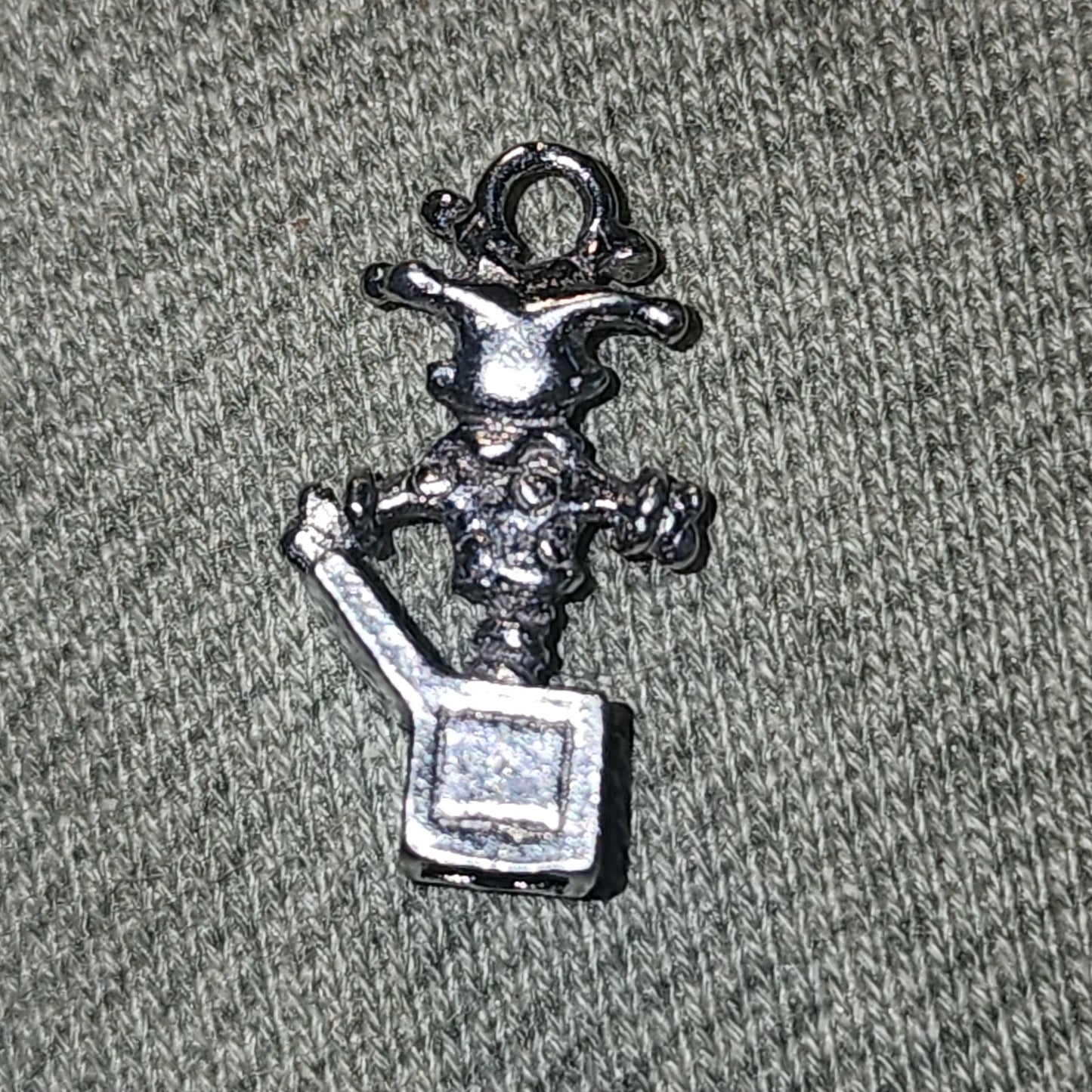 Metal jack in the box charm