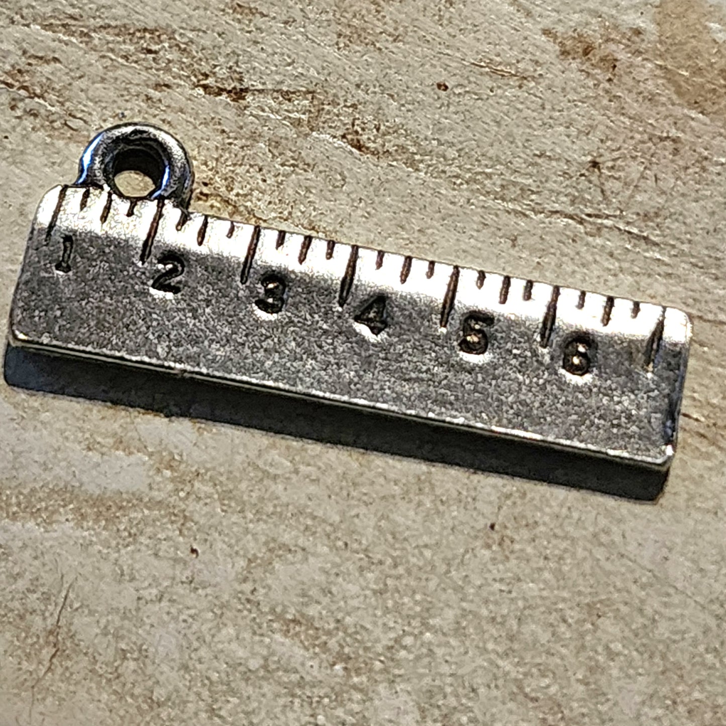 Metal ruler charm