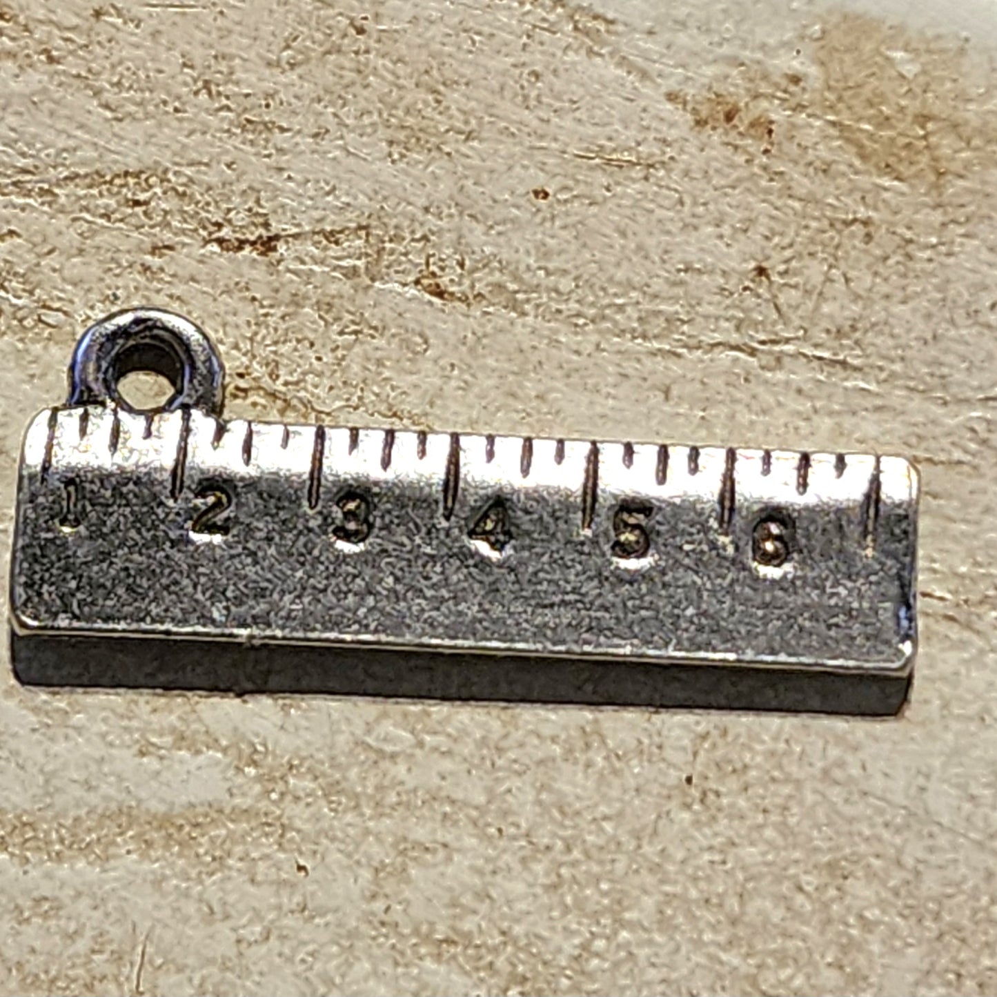 Metal ruler charm