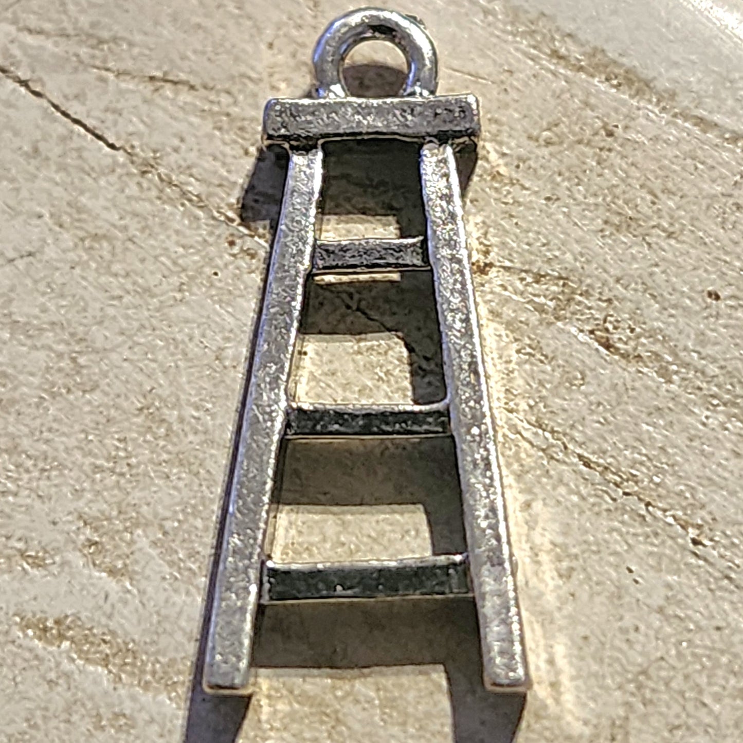 Metal ladder charm