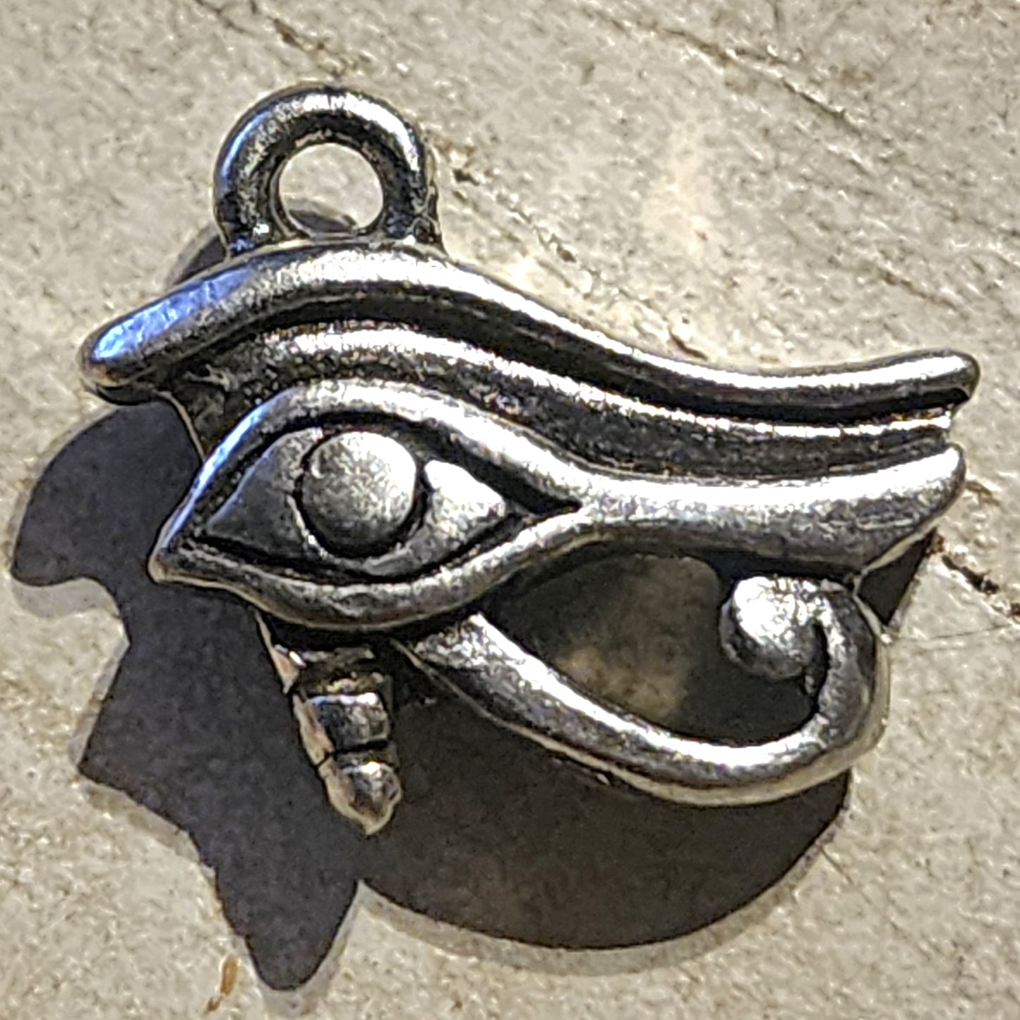 Metal evil eye charm