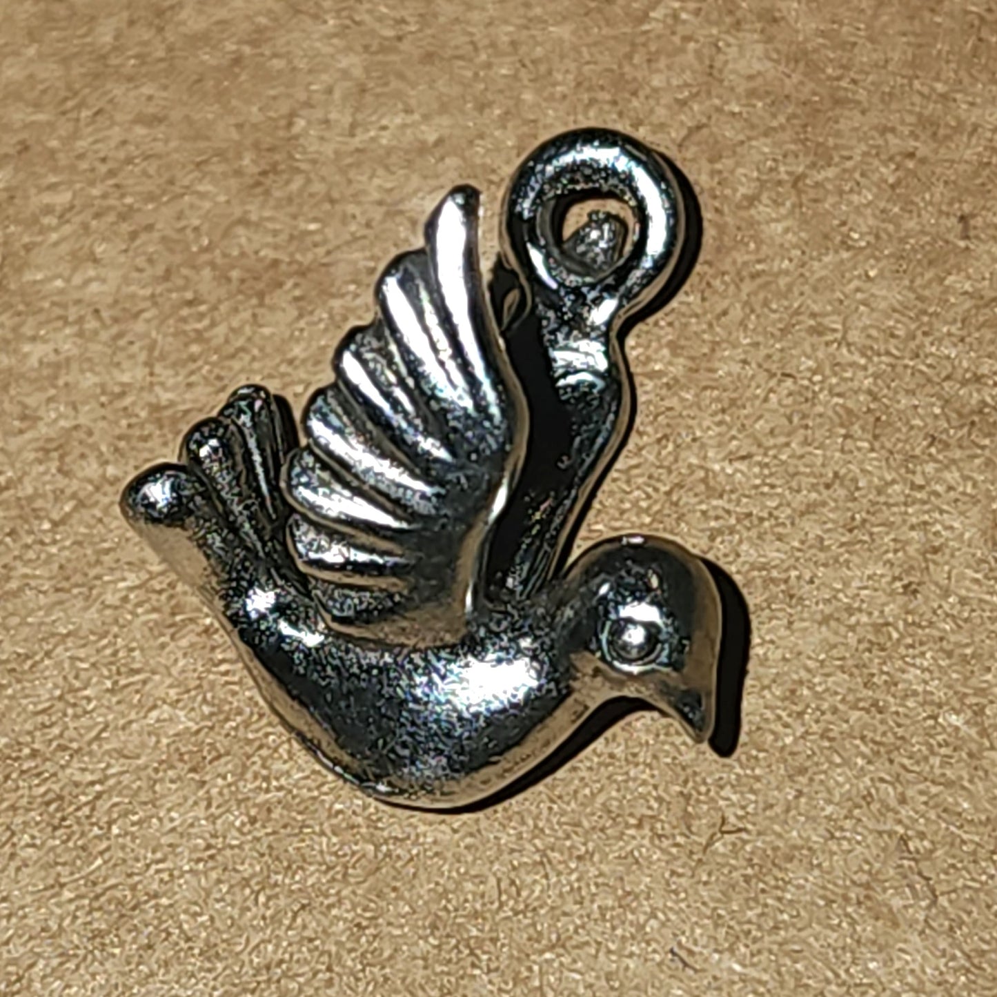 Metal dove charm