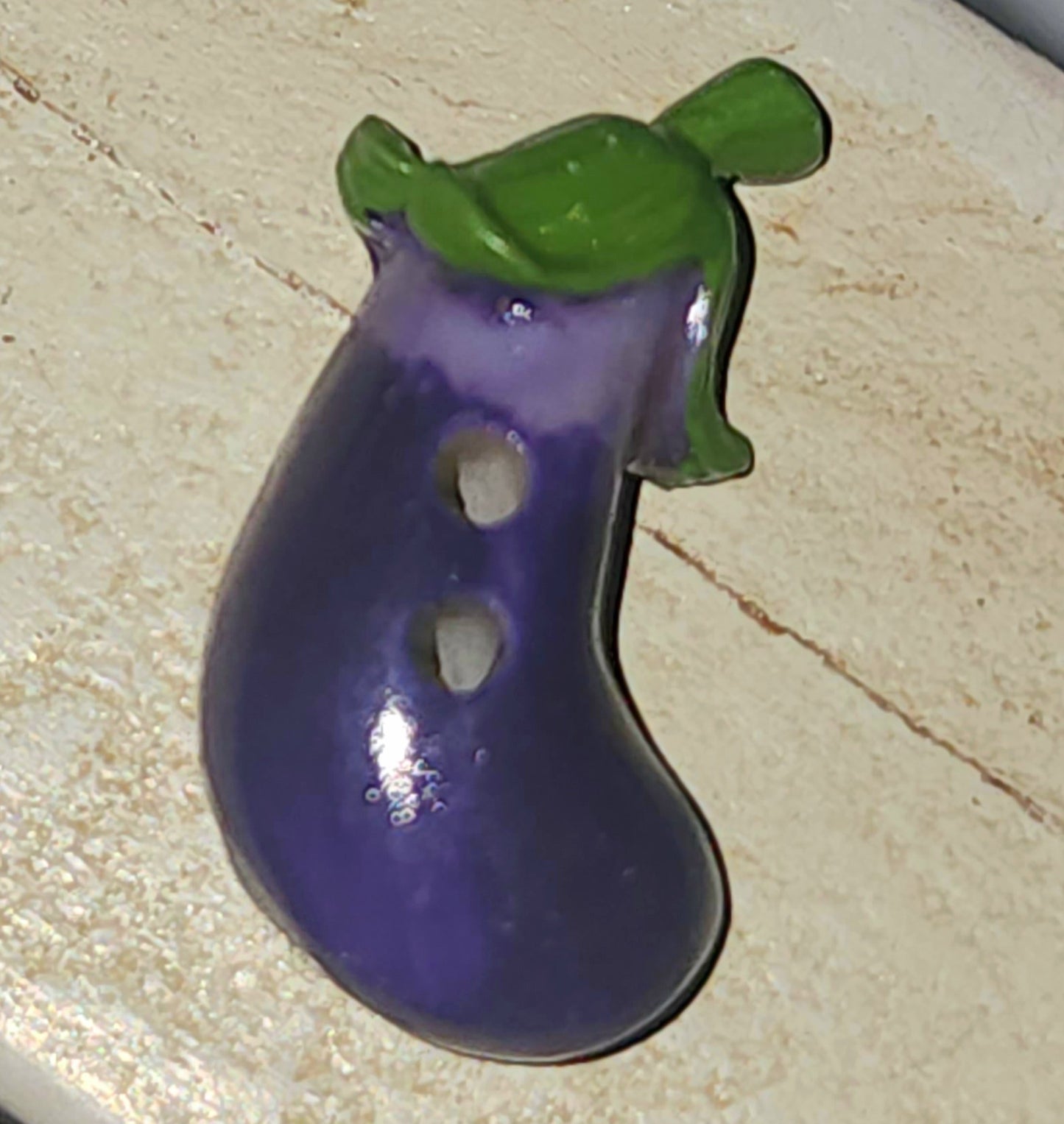 Resin eggplant button 25mm long