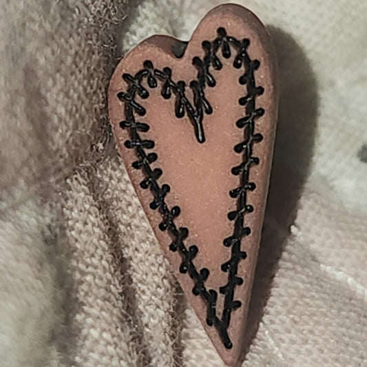 Skinny stitched look heart button in rose pink 13mm high