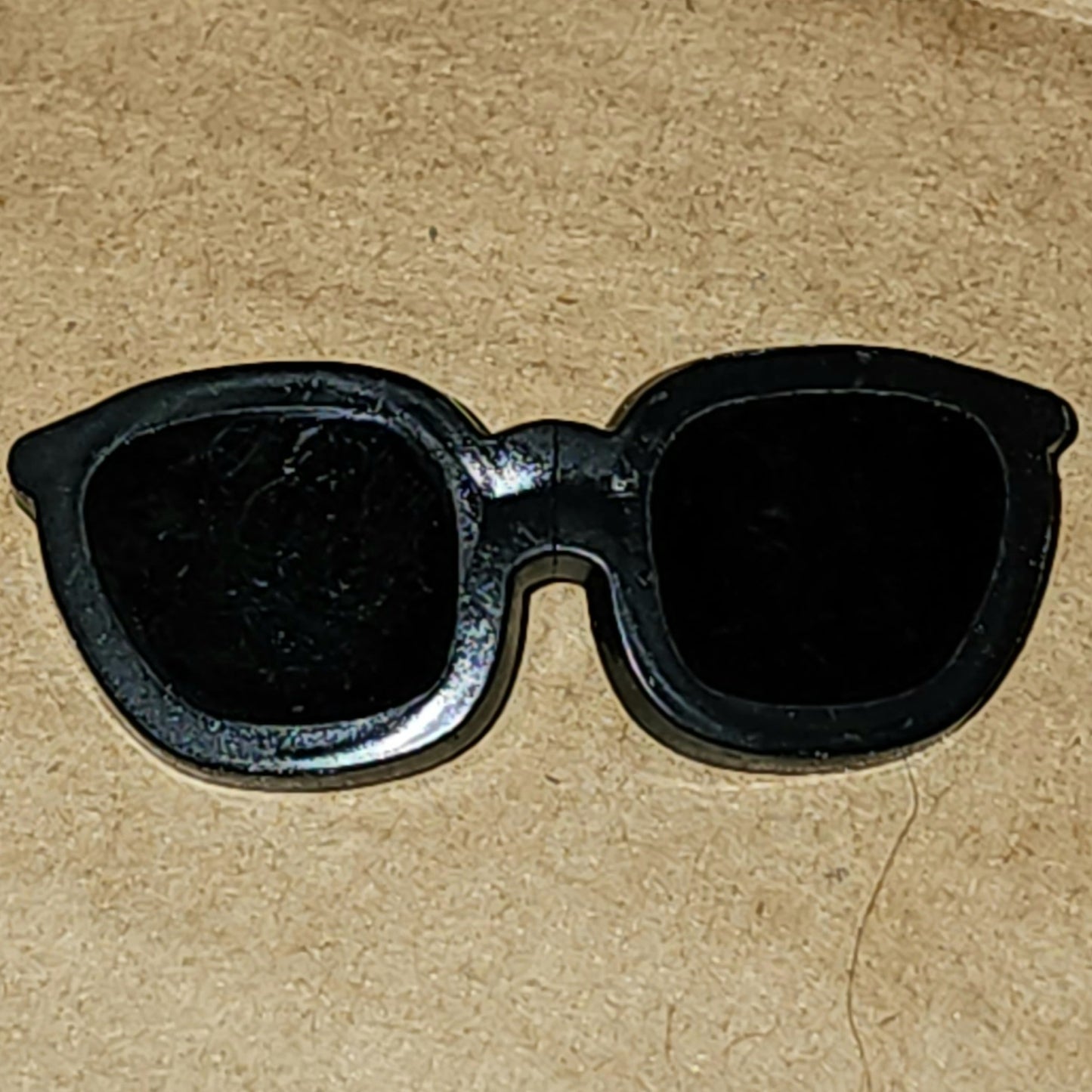 Sunglasses button