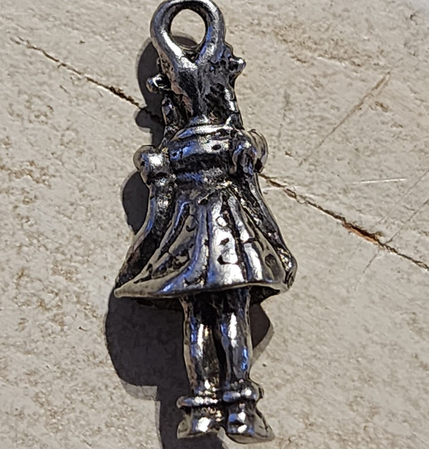 Metal girl charm