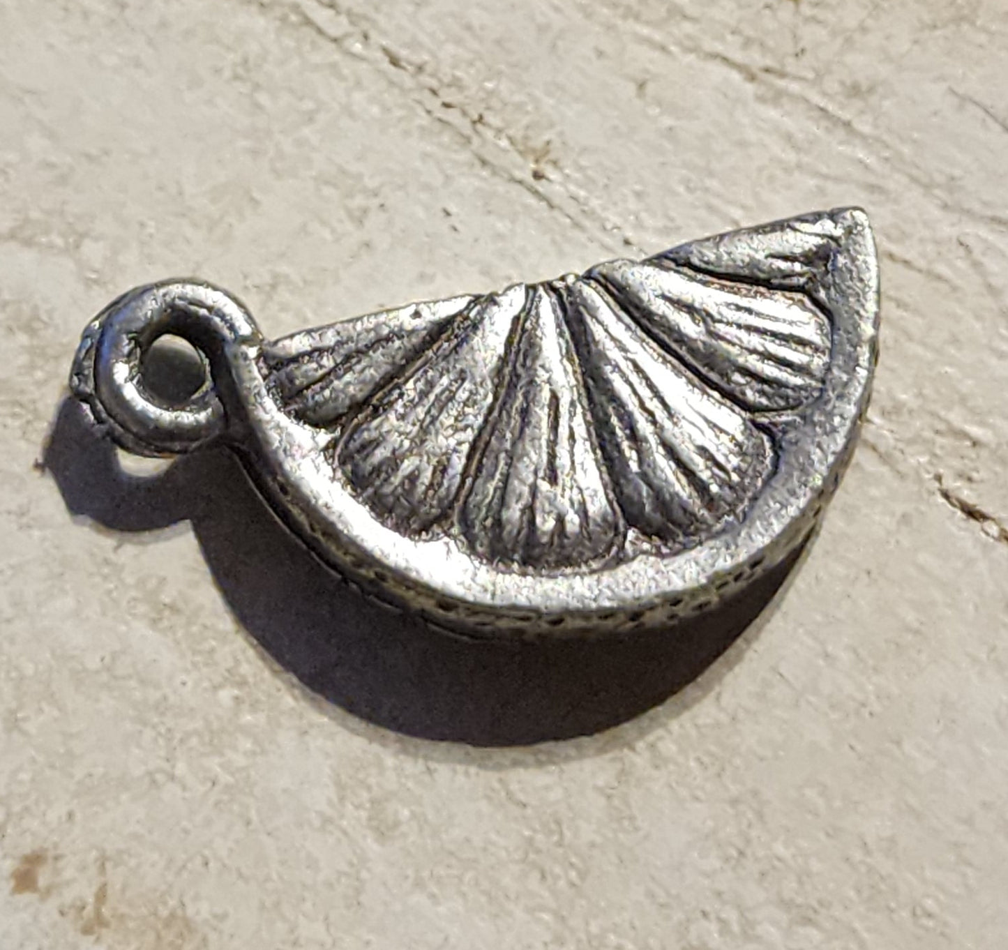 Metal lemon or orange slice charm