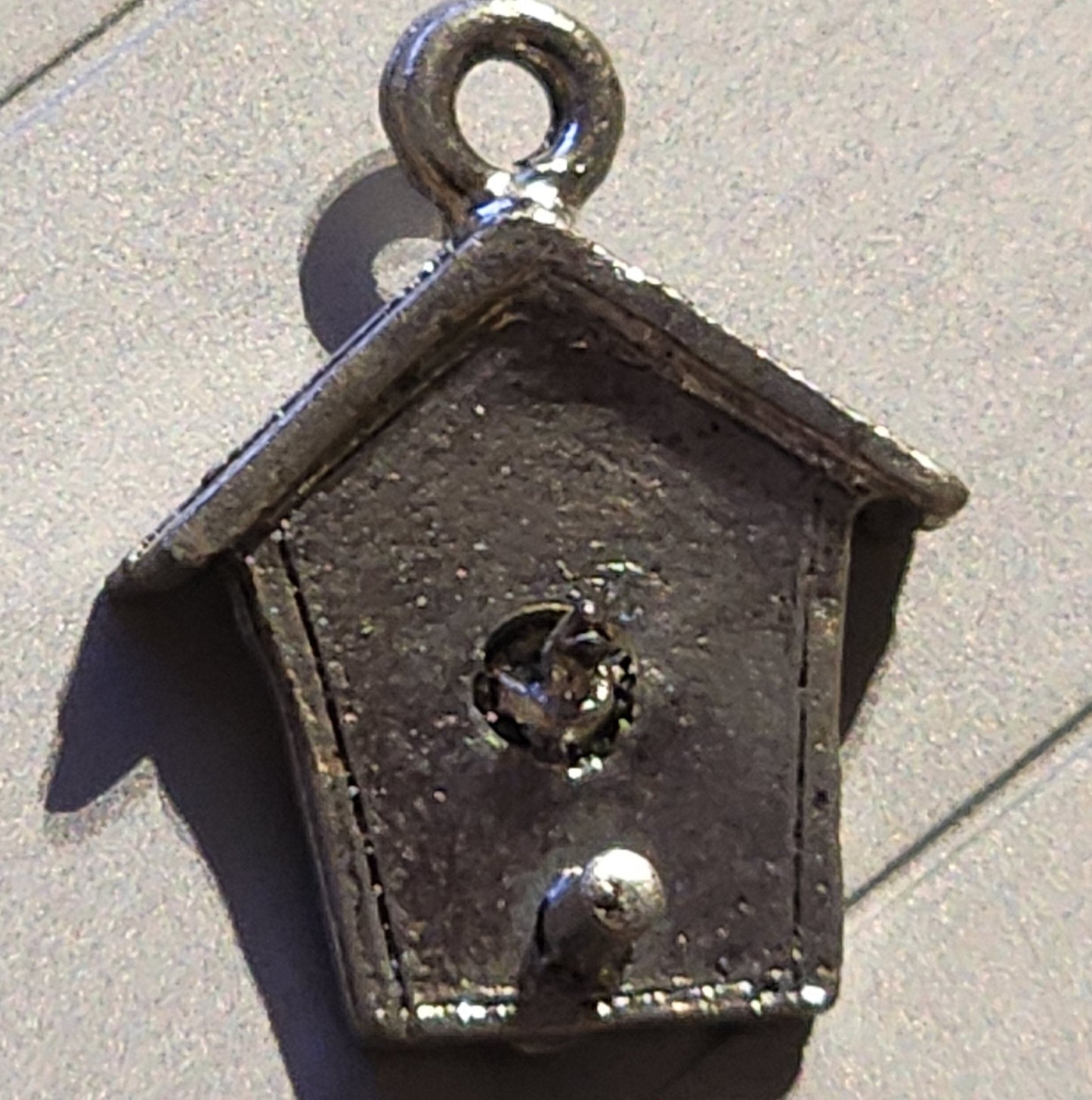 Metal birdhouse charm