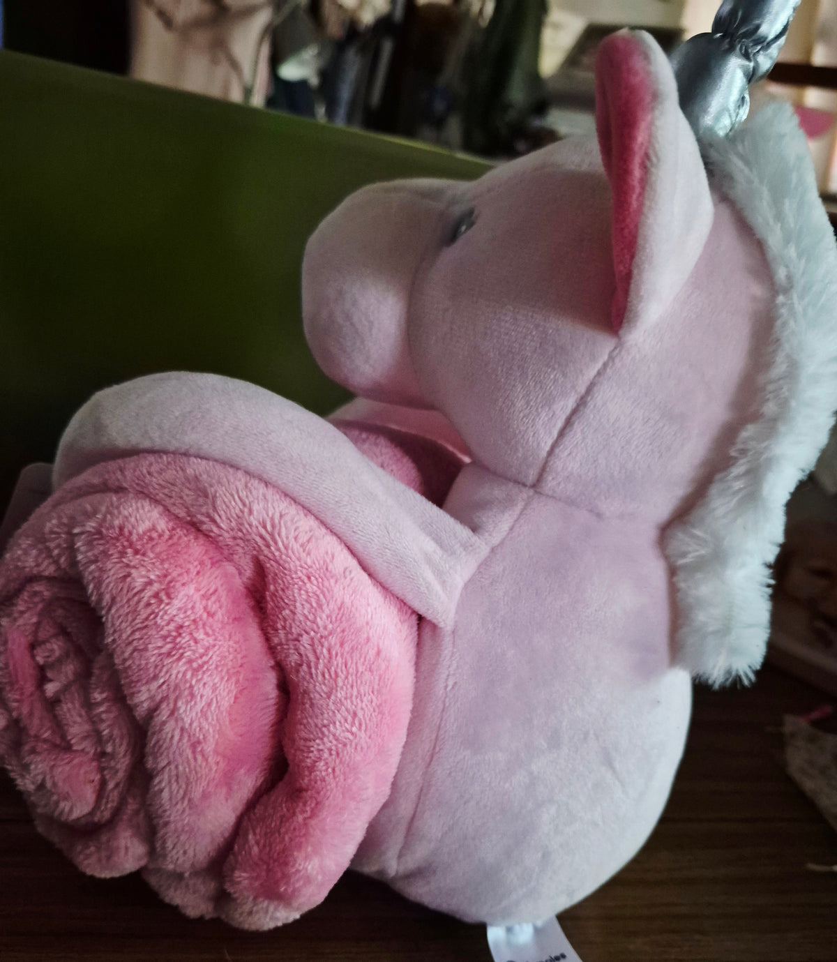 Pink plush unicorn with crib blanket