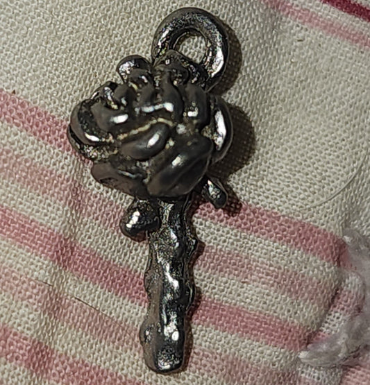 Metal rose on a stem charm