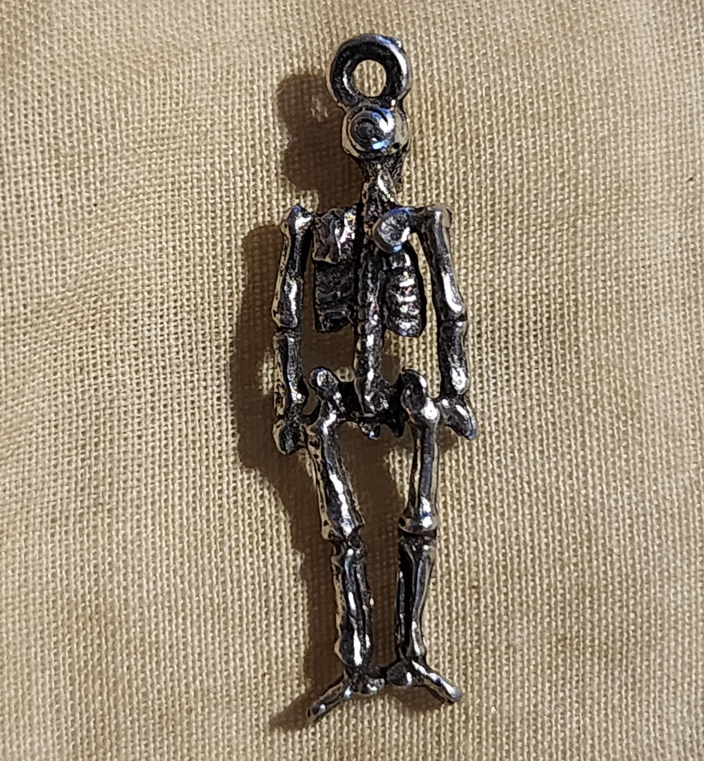 Metal skeleton charm approx 2cm high