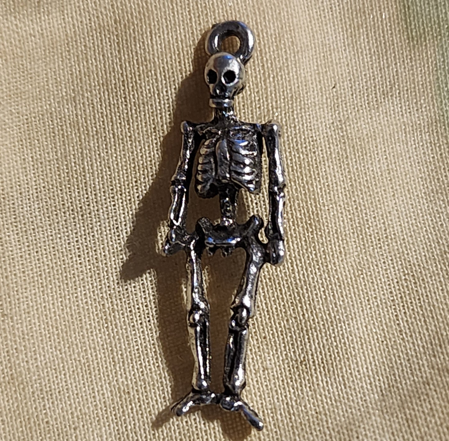 Metal skeleton charm approx 2cm high