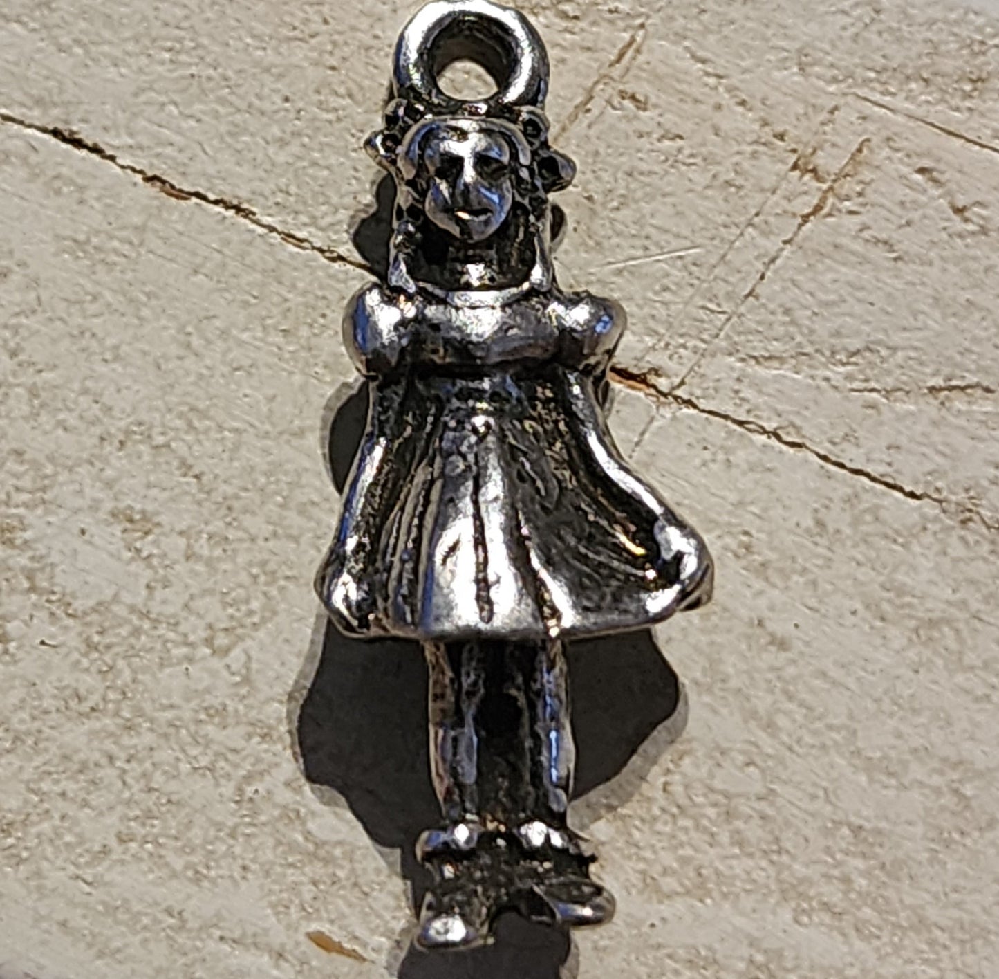 Metal girl charm